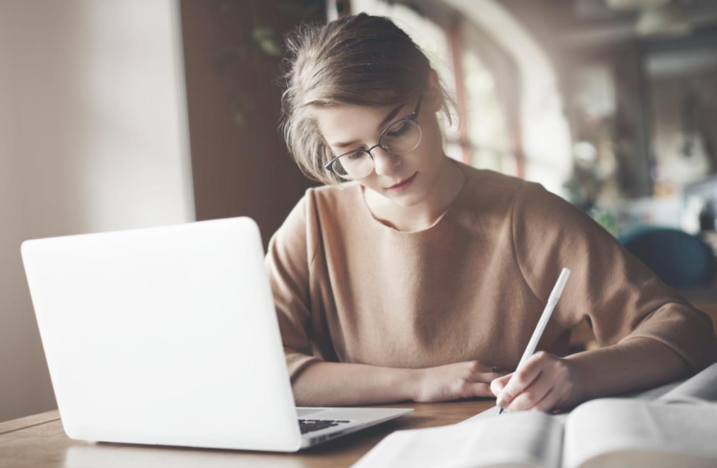 SEO professional analyzing e-commerce website performance metrics on multiple monitors